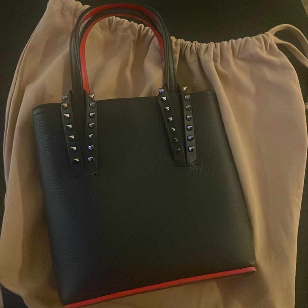 NEW. Never used Louboutin purse 👛 with dust bag